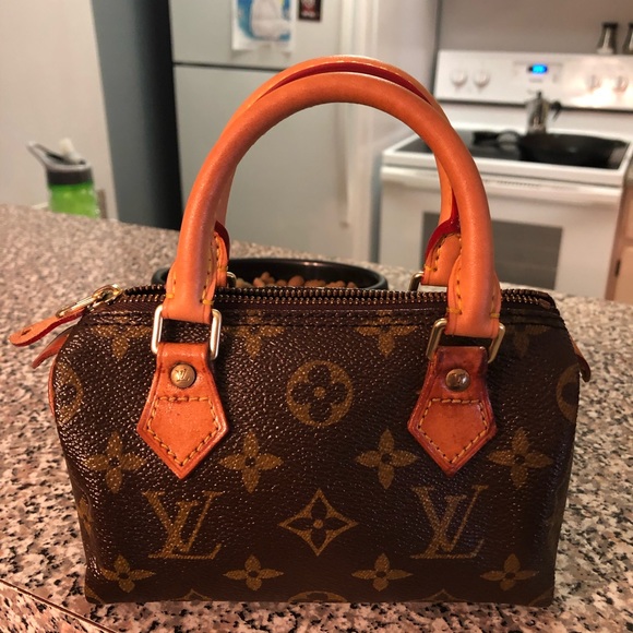 Louis Vuitton Handbags - Louis Vuitton Mini Speedy. Includes dust bag.